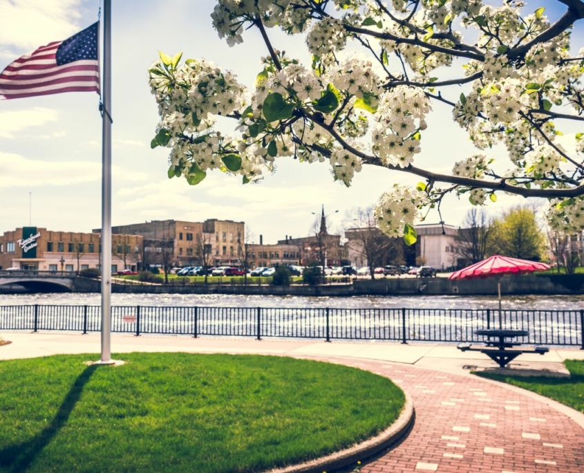 An American flag by the Rock River in Janesville, Wisconsin